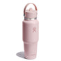 A 32 oz pink Hydro Flask Wide Mouth Travel Bottle with a Flex Straw Cap stands upright. The stainless steel bottle has a powder-coated finish, sturdy handle, screw-on lid, and displays the logo near the top.