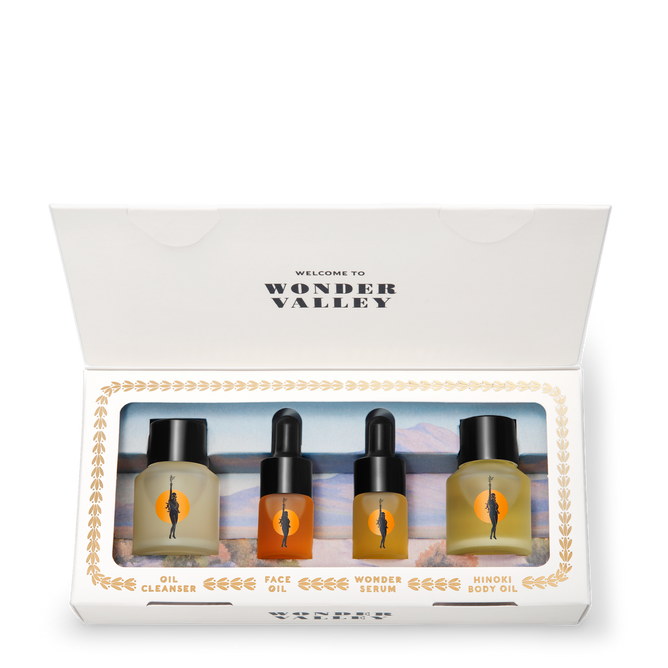 Little Wonders by Wonder Valley is a microbiome-friendly skincare set with four glass dropper bottles—oil cleanser, face oil, wonder serum, and hinoki body oil—beautifully presented in white packaging.