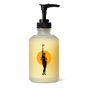 The Wonder Valley Facial Oil Cleanser comes in a frosted pump bottle featuring a minimalist black illustration of a woman holding a plant above her head in front of an orange circle—perfect for your facial cleansing routine.