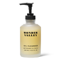 A clear pump bottle labeled Wonder Valley Facial Oil Cleanser with black text contains a pale yellow cleanser. The 200 mL (6.8 fl oz) bottle is shown against a white background, offering gentle cleansing for hydrated skin.