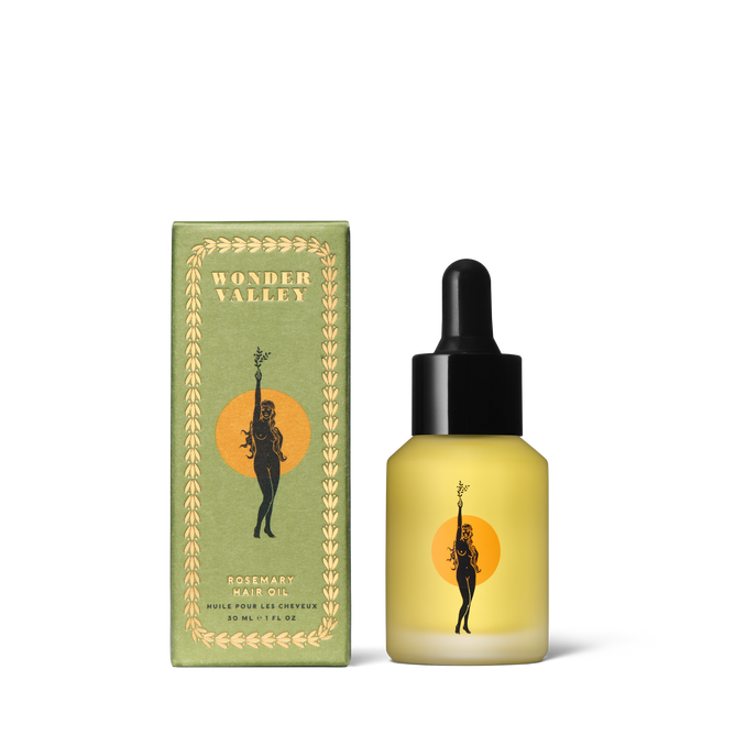 A green box and dropper bottle of Wonder Valley Rosemary Hair Oil, each showing a person with a branch before an orange circle. This yellow oil nourishes hair and helps treat split ends for healthier-looking results.