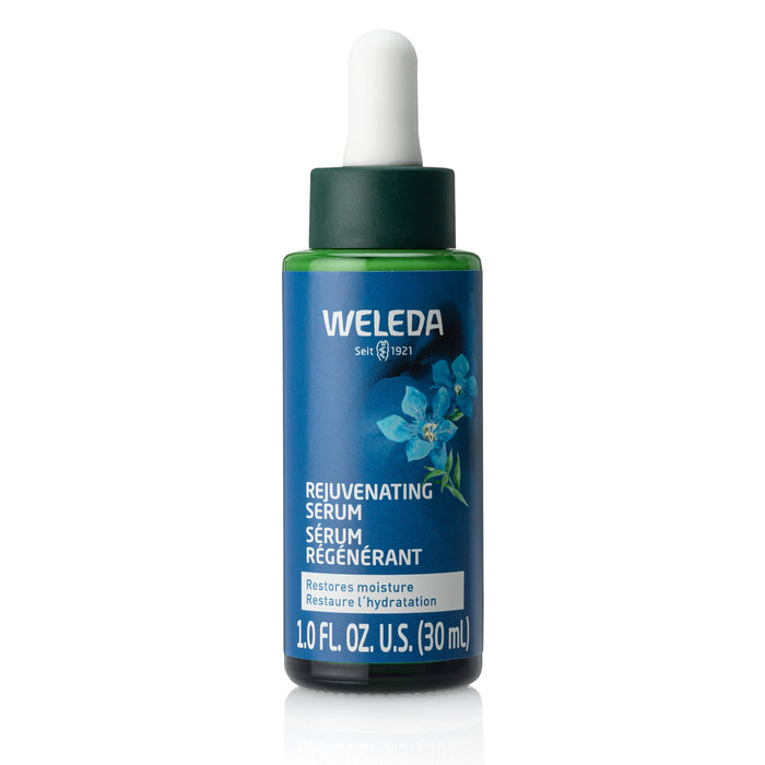 A 30 mL dropper bottle of Weleda Rejuvenating Serum with blue and green label, featuring blue gentian and edelweiss flowers, plus product text in English and French.