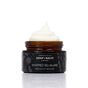 An open brown jar of Chagrin Valley Soap & Salve Whipped Squalane Face & Eye Mousee reveals a swirl of creamy white moisturizer inside, with a label featuring botanical illustrations.