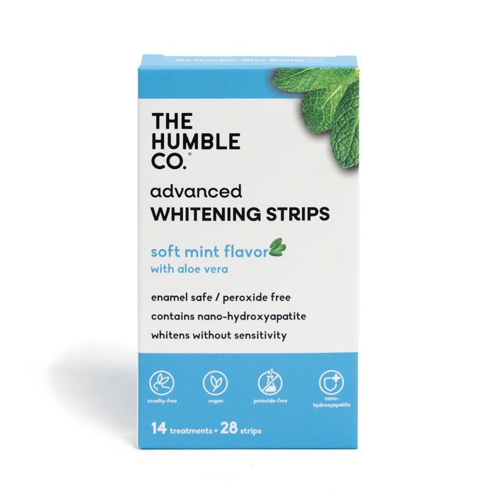 A box of The Humble Co. Advanced Whitening Strips offers soft mint flavor with aloe vera and nano-hydroxyapatite; it's enamel safe, peroxide-free, vegan, and contains 14 treatments (28 strips).
