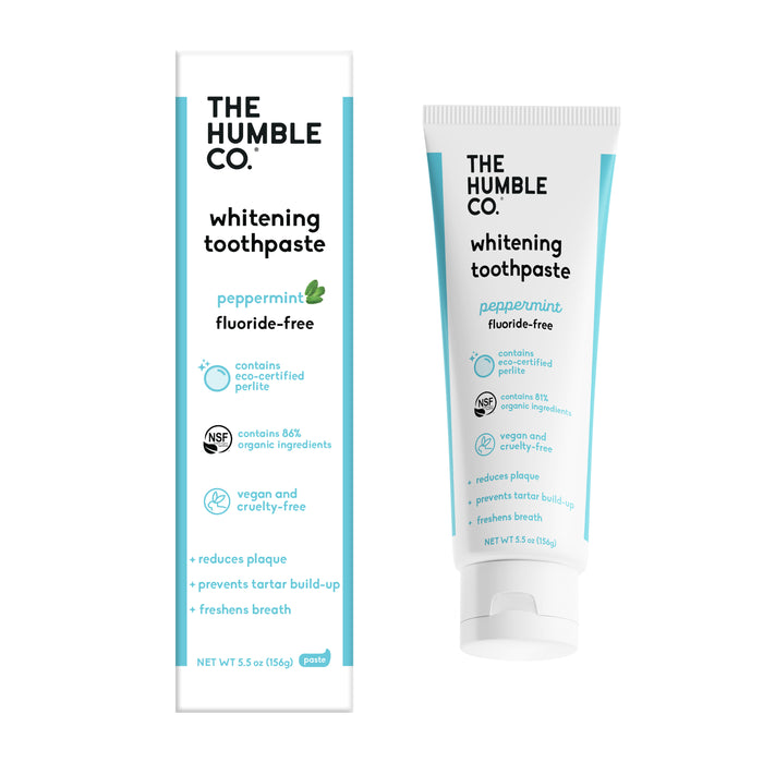 Tube and box of The Humble Co. Whitening toothpaste, peppermint flavor. Labels note it is cruelty-free, vegan, fluoride-free, eco-certified, made with eco-friendly ingredients, and helps reduce plaque and freshen breath.