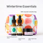 A vibrant polka-dotted cosmetics bag showcases three Mad Hippie favorites—Corrective Peptides Serum, Vitamin C Serum, and Triple C Night Cream—in front. The text Wintertime Essentials highlights these skincare must-haves.