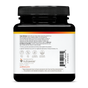 Back view of a Youtheory Total Body Turmeric supplement bottle in black, displaying usage warnings, nutritional icons, manufacturer details, and a barcode. The label cautions to keep out of reach of children and recommends consulting a physician prior to use. Formulated to support cognitive function and help address inflammation.