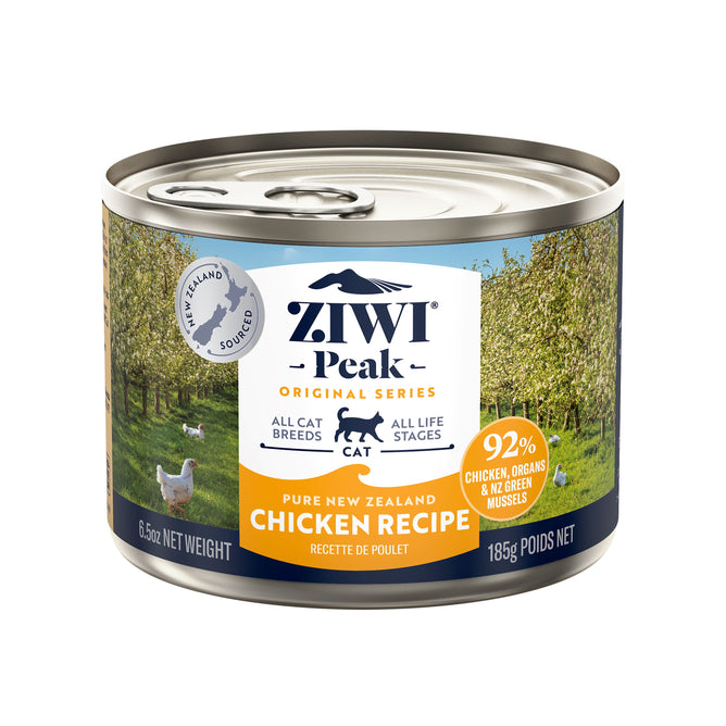 A 185g can of ZIWI Canned Wet Cat Food—Chicken, all-natural, grain-free, high protein with superfoods. The label features trees and a cat silhouette and it’s suitable for all cat breeds and life stages.