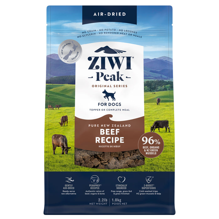 A bag of ZIWI Air-Dried Dog Food - Beef, all natural and grain free, made with high protein, limited ingredients, and superfoods. Packaging features cows in a green field and promotes air-drying technology for dogs.