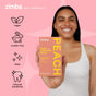 A smiling woman in a white tank top holds a box of Zimba Whitening Strips. Icons and text highlight vegan, cruelty-free, clean, and reduced sensitivity benefits for whiter teeth, set against a pink background.