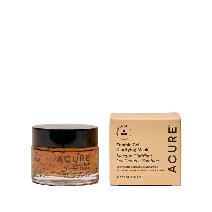 The Acure Zombie Cell Clarifying Mask, in a jar next to its beige box, is a vegan gel treatment that clarifies, boosts luminosity, and supports your skin’s moisture barrier with its brown speckled formula.