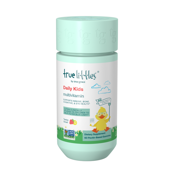 A light green bottle of True Littles Daily Kids Multivitamin with a cartoon chick holding a sign, clouds, and grass on the label. The bottle states it supports immune, bone, cognitive, and eye health.