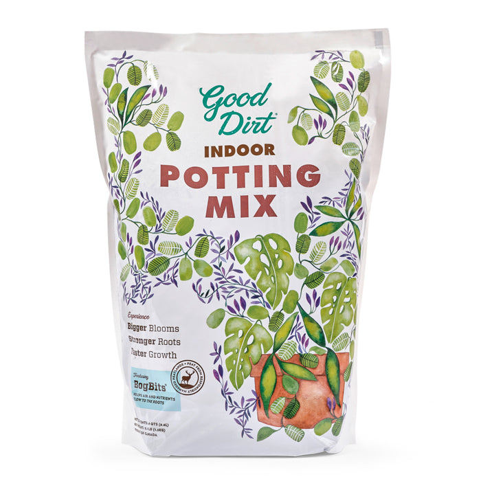 A white bag of Good Dirt Indoor Potting Mix featuring green leaf illustrations, bold text, and product benefits like bigger blooms, stronger roots, and faster growth on the front.