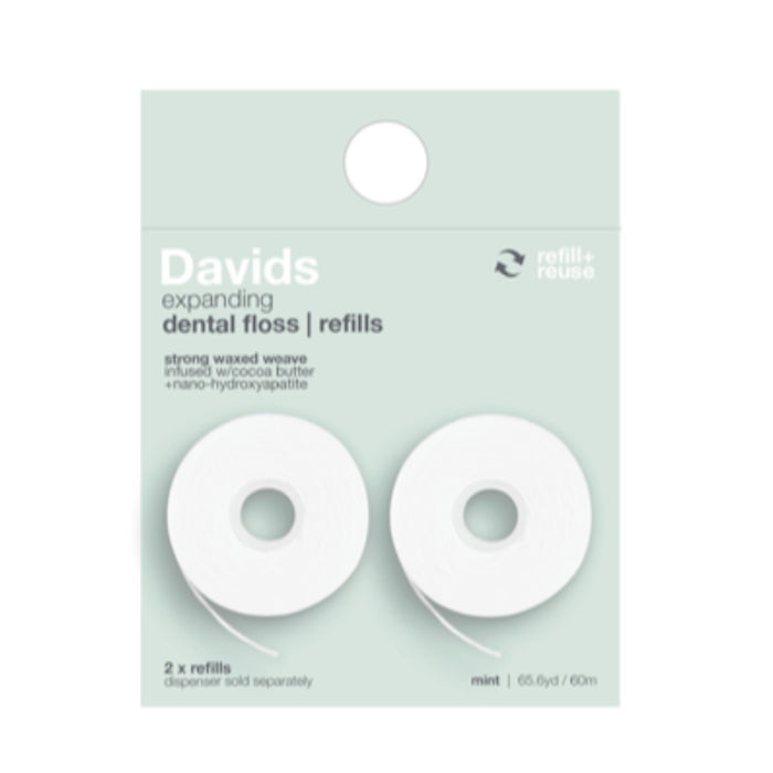 Two white rolls of Davids expanding dental floss refills are shown in clear packaging with mint flavor labeled on a green background. Text highlights they are strong, waxed, and come with two refills.