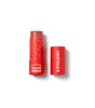 A red Axiology multi-stick color cream with its lid removed and placed beside it on a white background. The product is partially twisted up, revealing a creamy cosmetic stick.