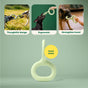 A promotional image showing a green rubber dog toy with a loop handle. Three photos above depict dogs playing with the toy. Text reads: 