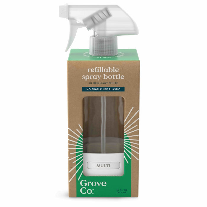 A refillable spray bottle in brilliant white from Grove Co. is packaged in a cardboard box with a green and brown design. The bottle is visible through a clear window, and the label reads MULTI.