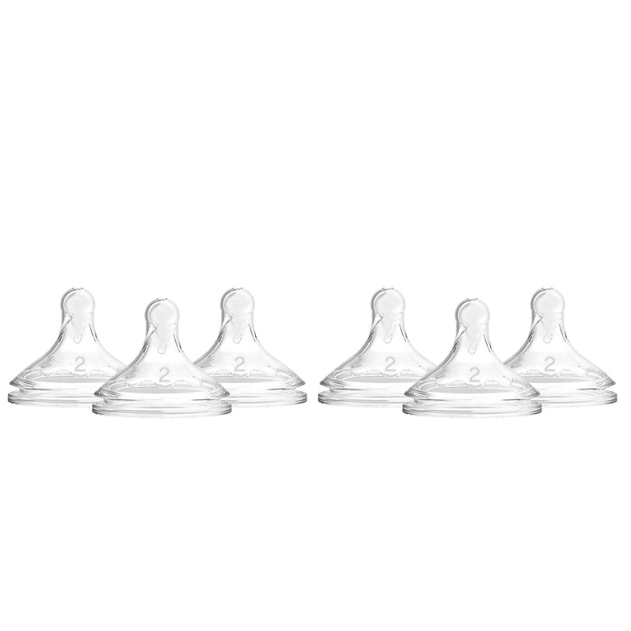 Six transparent silicone baby bottle nipples are arranged in two rows on a white background. Each nipple has the number 2 embossed on the front, indicating the flow level.