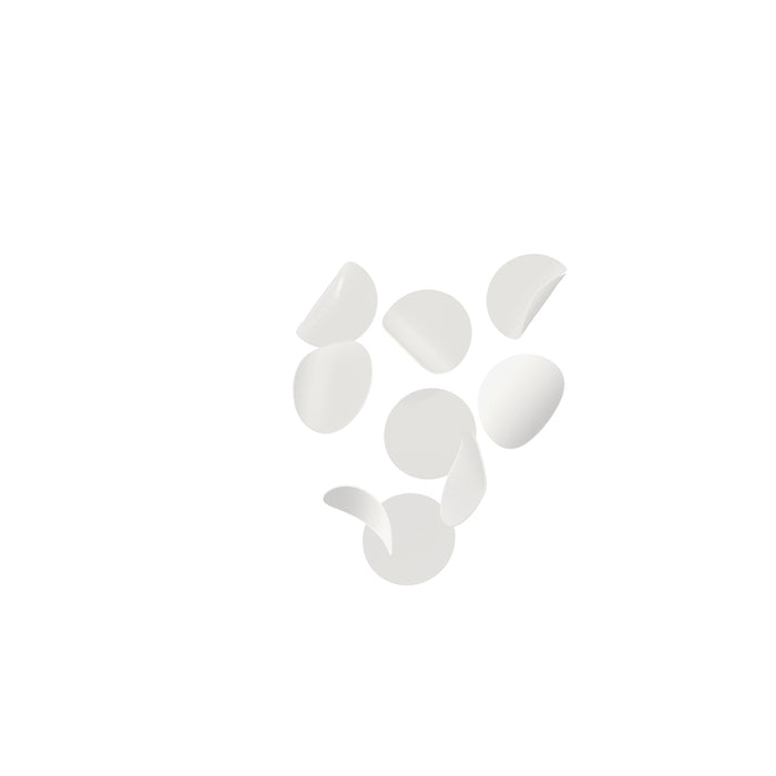 Seven white, curved potato chips are scattered on a white background.