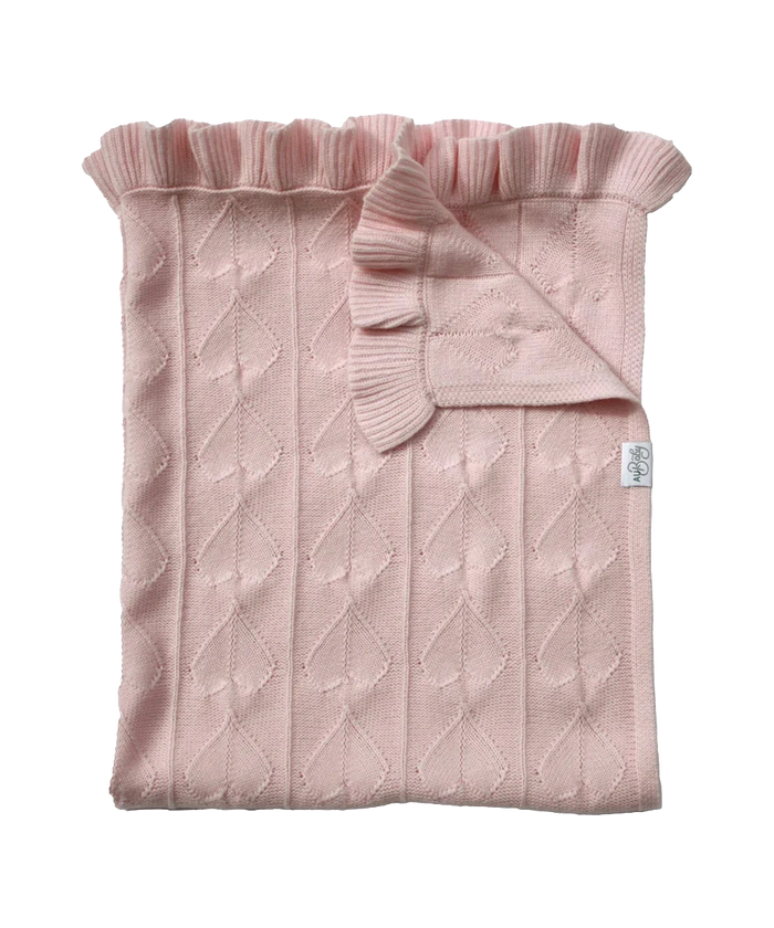 AU Baby Little Love Blanket - Peony: a light pink organic merino wool baby blanket with a heart-patterned texture and a ruffled edge.