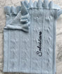 Light blue Little Love Blanket - Hydrangea organic knit baby blanket with a heart pattern, a ruffled edge, and the name Sebastiano embroidered in script.