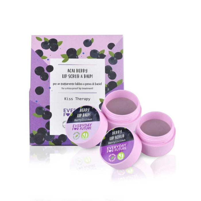 Purple containers of Berrylicious Acai Berry Lip Scrub & Balm are displayed in front of a matching, berry-themed product box labeled “Kiss Therapy” and “Everyday for Future.” One container is open, showing the product inside.