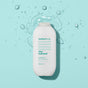 A white bottle of method Body Wash Stay Hydrated, featuring a plant-based and cruelty-free formula, is set against a light blue background with water droplets. The label displays teal text and raindrop graphics, containing 532 ml (18 fl oz) of invigorating product.