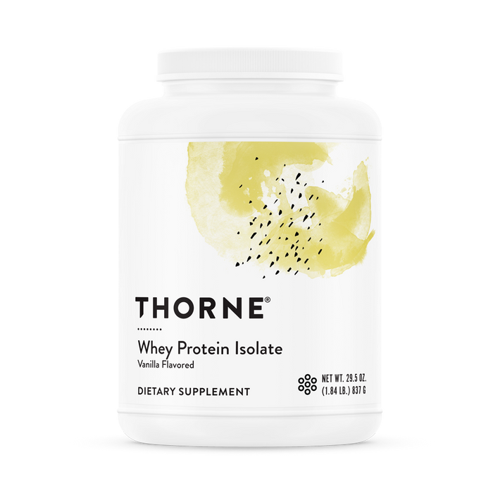 A white container of Thorne Whey Protein Isolate, vanilla flavored, with a yellow abstract design on the label. The container is labeled as a dietary supplement, net weight 29.5 oz (1.84 lb) 837 g.