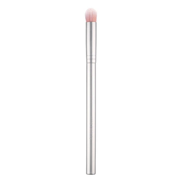 A silver makeup brush with a long handle and soft, rounded bristles that are white at the base and fade to light pink at the tips, shown on a white background.