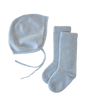 Light blue organic cashmere knit baby bonnet with tie straps and a pair of matching knit baby socks from the Cashmere Cloud Baby Blanket Gift Set - Hydrangea.