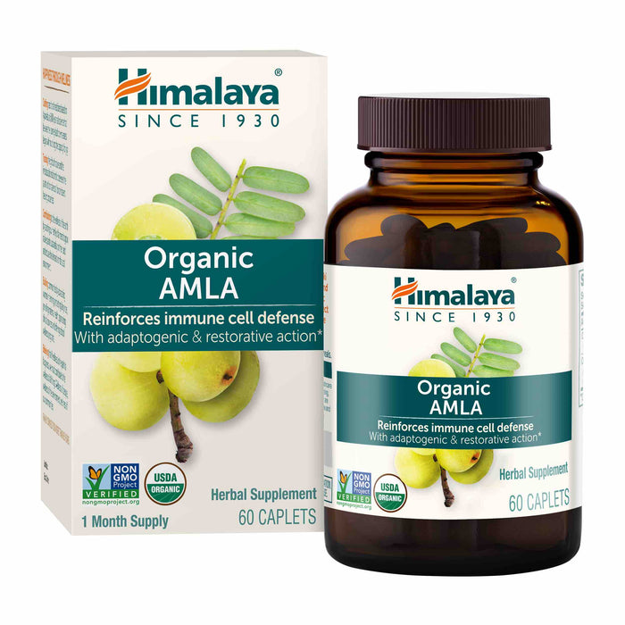 A brown bottle and its packaging box labeled Himalaya Organic Amla, a herbal supplement for immune cell defense. The box shows green amla fruits and leaves, and indicates 60 caplets with USDA Organic and Non-GMO badges.