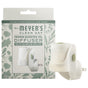 A Mrs. Meyer's Premium Scented Oil Diffuser is displayed before its packaging, which features botanical designs and product info. The white diffuser with a green accent fills your space with fresh, garden-inspired scents for a revitalizing atmosphere.