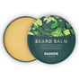 Open tin of Badger Balm Organic Beard Balm - Condition & Tame, with a floral and citrus design on the lid. Inside is a smooth, solid, yellowish conditioning beard balm. The lid features text: “Beard Balm Condition & Tame Certified Organic Badger.”.