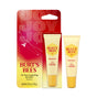 Two tubes of Burt’s Bees Beewax Lip Balm Hydrating Squeeze, made with moisturizing beeswax to hydrate dry lips—one shown in special packaging with a vibrant red and orange JOY design featuring bees and stars, and one tube displayed outside the package.