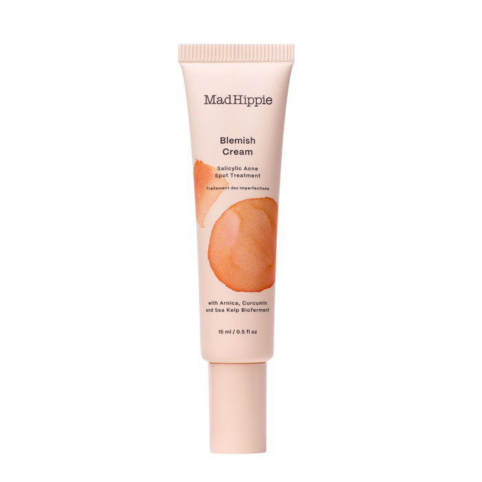 A tube of Mad Hippie Blemish Cream with salicylic acid, arnica, curcumin, and sea kelp bioferment, designed for spot treatment of acne and skin imperfections, shown against a white background.