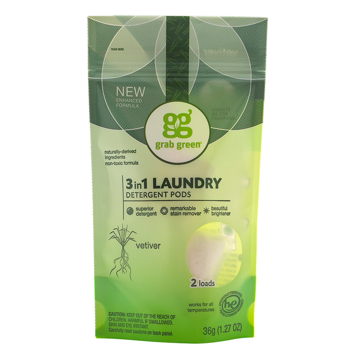 A resealable pouch of Grab Green 3-in-1 Laundry Detergent Pods in vetiver scent, featuring green and white packaging, labeled for 2 loads and made with naturally-derived ingredients.
