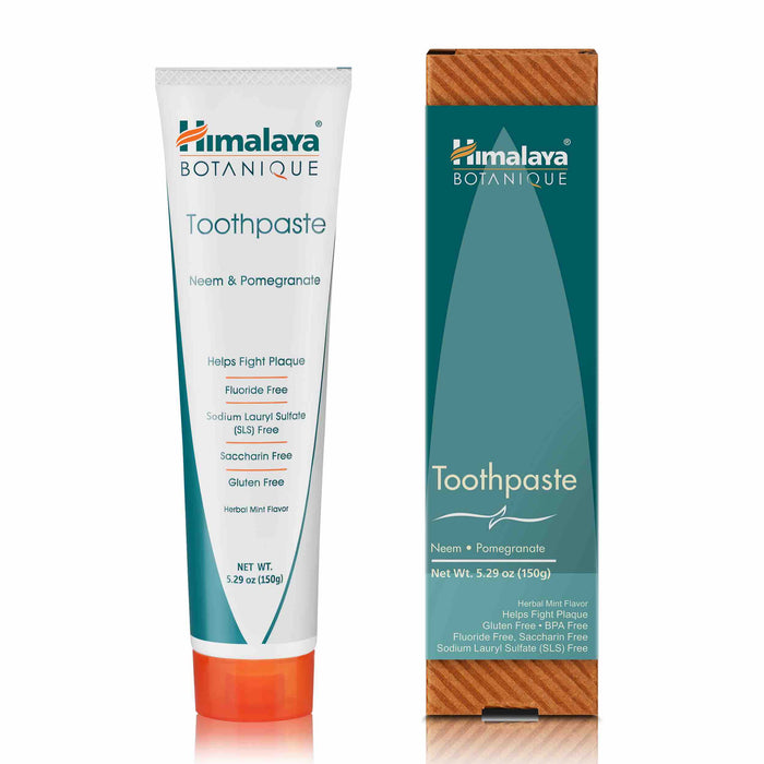 Himalaya Botanique Neem & Pomegranate Toothpaste tube and box. Box is wood-textured with teal section. Tube lists features: fluoride-free, SLS-free, saccharin-free, gluten-free, and herbal mint flavor.