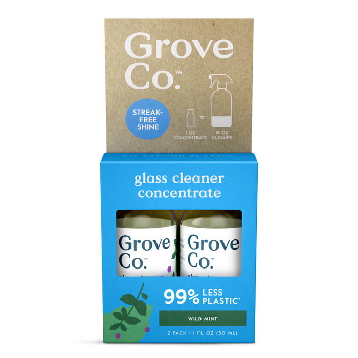 A package of Grove Co. glass cleaner concentrate in wild mint scent, featuring two 1 fl oz bottles. The box highlights “99% less plastic” and “streak-free shine” with a simple graphic of a spray bottle.