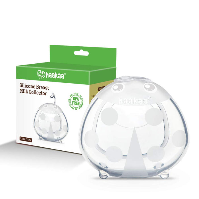 A clear silicone breast milk collector with white accents is shown in front of its green and white Haakaa box packaging, which highlights that it is BPA free and holds 75ml (2.5oz).