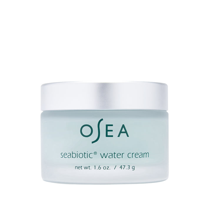 A jar of OSEA Seabiotic Water Cream with a silver lid and light blue container, labeled OSEA seabiotic water cream net wt. 1.6 oz. / 47.3 g on the front.