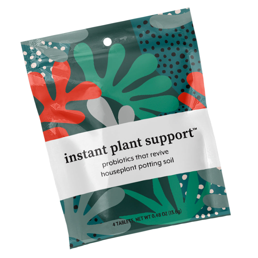 The vibrant package with abstract leaf patterns contains Instant Plant Support by Instant Plant Food, designed to rejuvenate houseplant potting soil as probiotics for healthy growth.