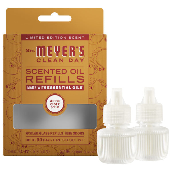 Mrs. Meyer's Scented Oil Refills in Apple Cider scent come with two clear bottles with white caps, ideal for your plug-in diffuser to fill any room with lasting freshness.