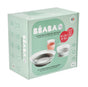 A green and white Béaba box displays a glass meal set with suction pads for babies aged 4 months and up, showing images of a glass, a bowl, and a plate. The packaging indicates it is made in France.