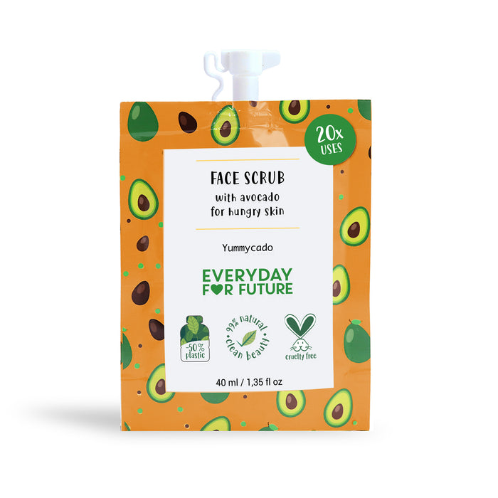 A face scrub pouch with an avocado pattern, labeled Face Scrub with avocado for hungry skin. It offers 20 uses, is vegan, cruelty-free, and made with 50% less plastic. The pouch contains 40ml.