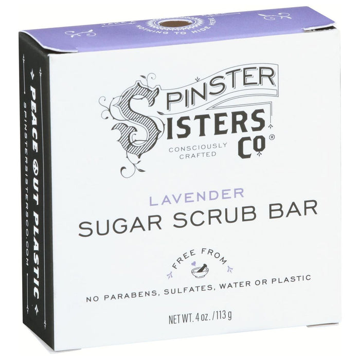 A white and lavender box labeled Spinster Sisters Co. Lavender Sugar Scrub Bar, stating it is free from parabens, sulfates, water, or plastic. The packaging highlights Peace Out Plastic on the side.