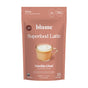 A pink packet of blumes Vanilla Chai Blend features a latte image and labels for organic, 25 servings, no sugar, medium caffeine, with natural flavors. It weighs 3.53 oz (100g) and combines creamy vanilla with aromatic spices in the Vanilla Chai flavor.