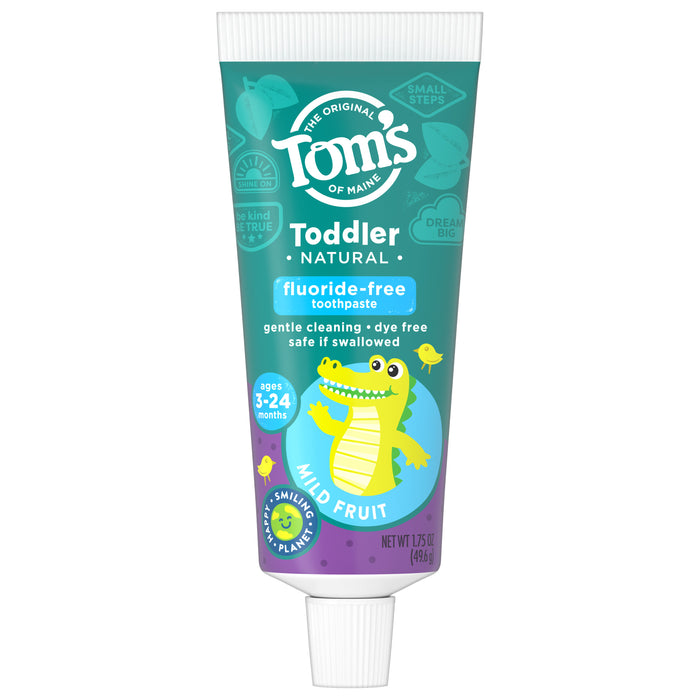 Tube of Toms of Maine Toddler Natural Fluoride-Free Toothpaste, mild fruit flavor, for ages 3-24 months. The tube features a smiling cartoon alligator and highlights gentle cleaning, dye-free, and safe if swallowed.