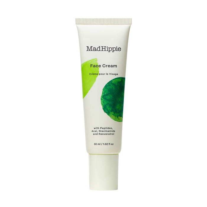 A tube of Mad Hippie Face Cream with green leaf graphics and text indicating it contains peptides, acai, niacinamide, and resveratrol; 30 ml (1.02 fl oz) size.