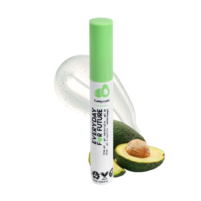 A tube of Everyday Perfume with a green cap stands upright in front of an avocado, a smear of gel, and a seed. The label features an avocado icon and the word Yummycado.