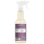A spray bottle of Mrs. Meyer’s Multi-Surface Cleaner with a purple label and white nozzle, featuring ingredient and direction details, is displayed against a white background.